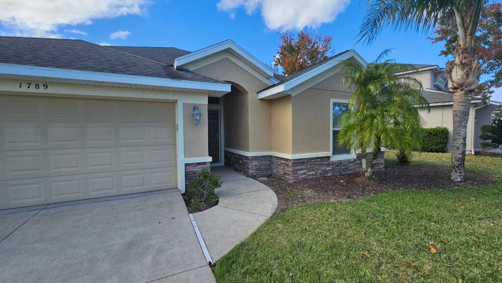 Professional exterior house painting and surface protection in Florida.