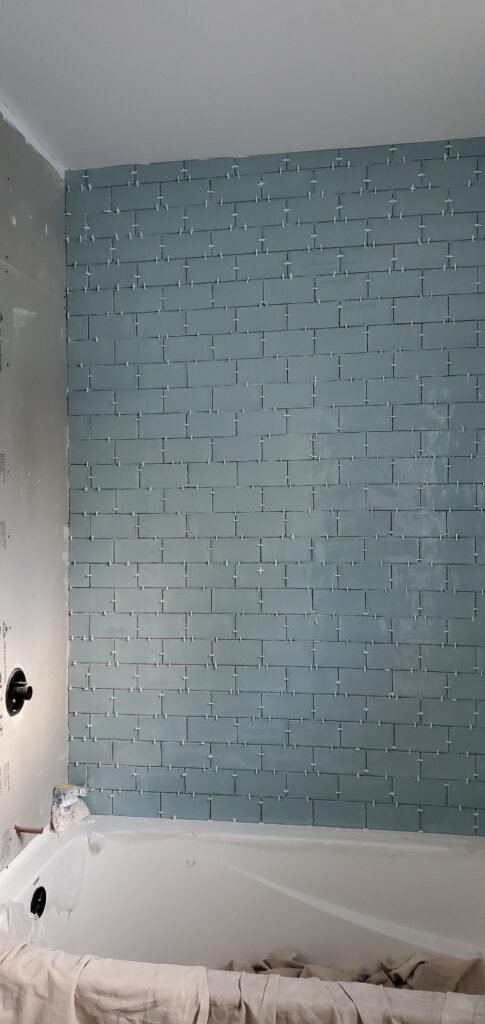 Modern bathroom remodeling with new tile and paint in Daytona Beach Shores Florida