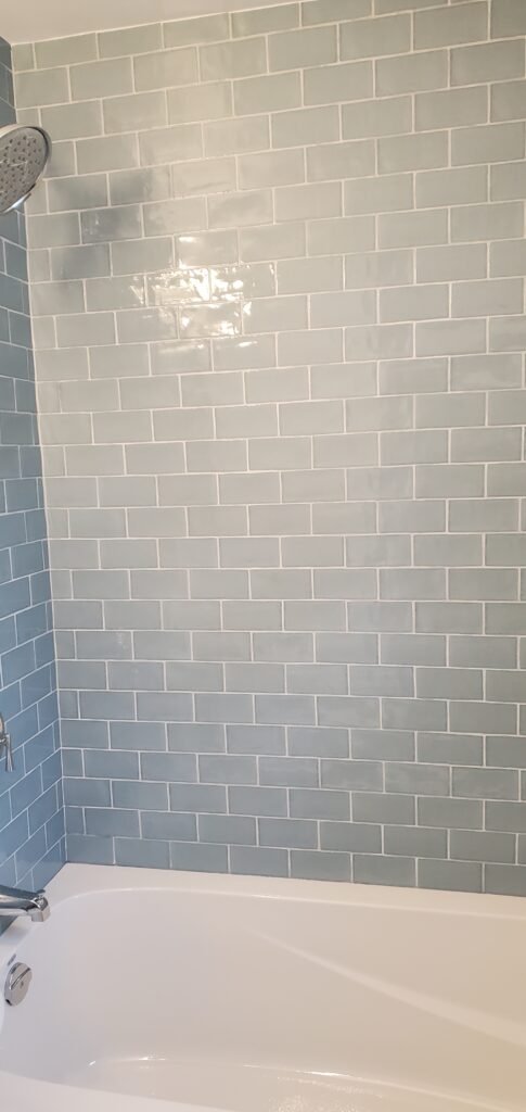 Custom bathroom renovation with new tile and paint in South Daytona Florida