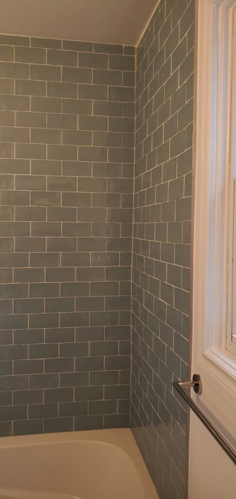 Modern bathroom remodeling with new tile and paint in Daytona Beach Florida