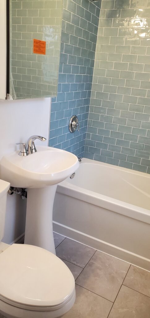 Modern bathroom remodeling with new tile and paint in Daytona Beach Shores Florida