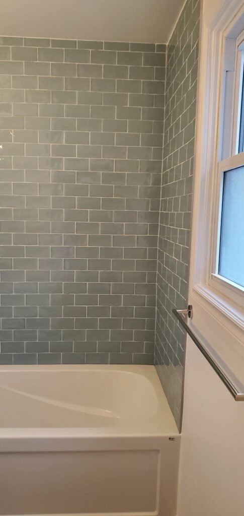 Custom bathroom renovation with new tile and paint in South Daytona Florida