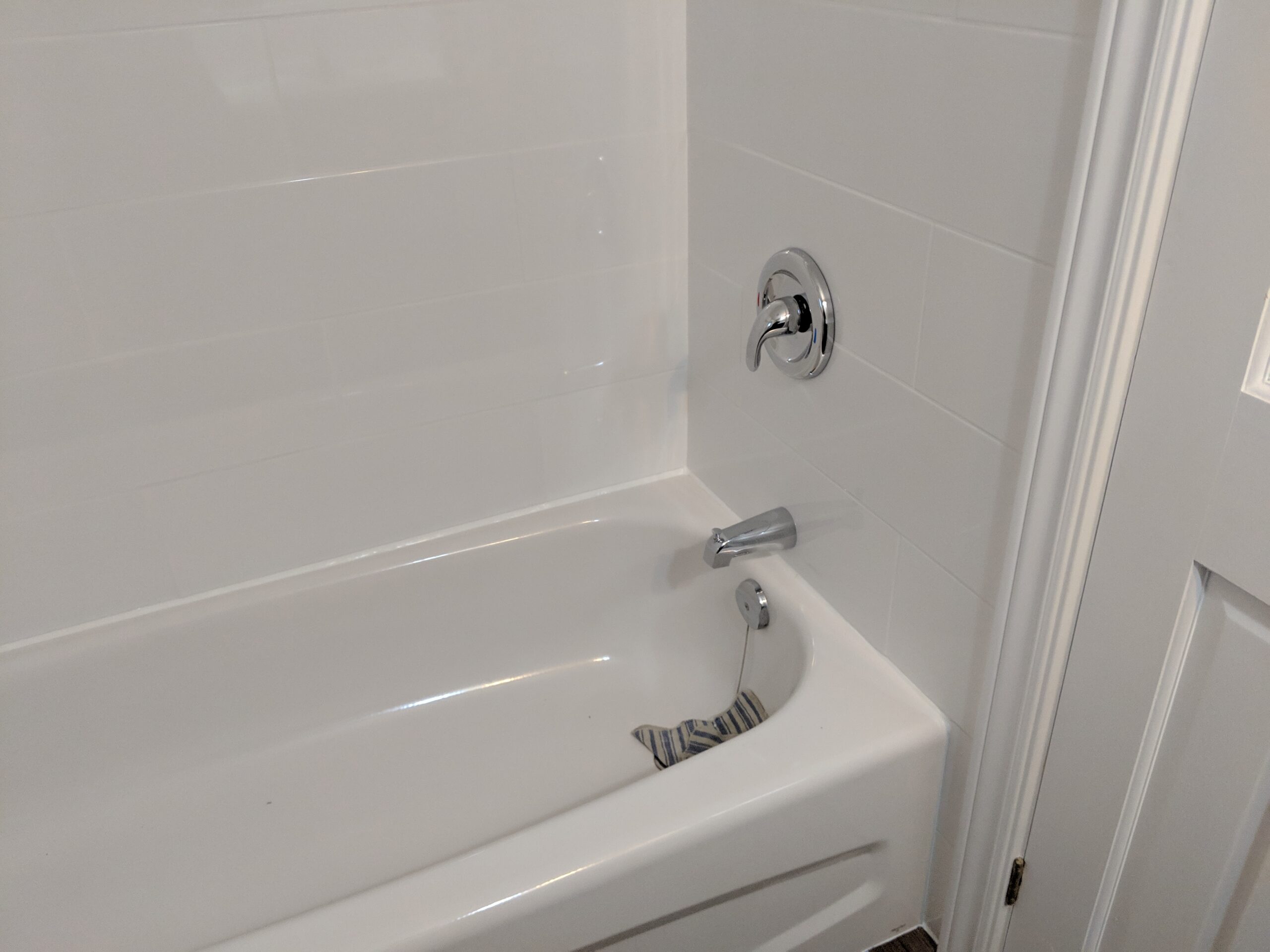 Modern bathroom renovation with new tile and paint in Wilbur-By-The-Sea Florida