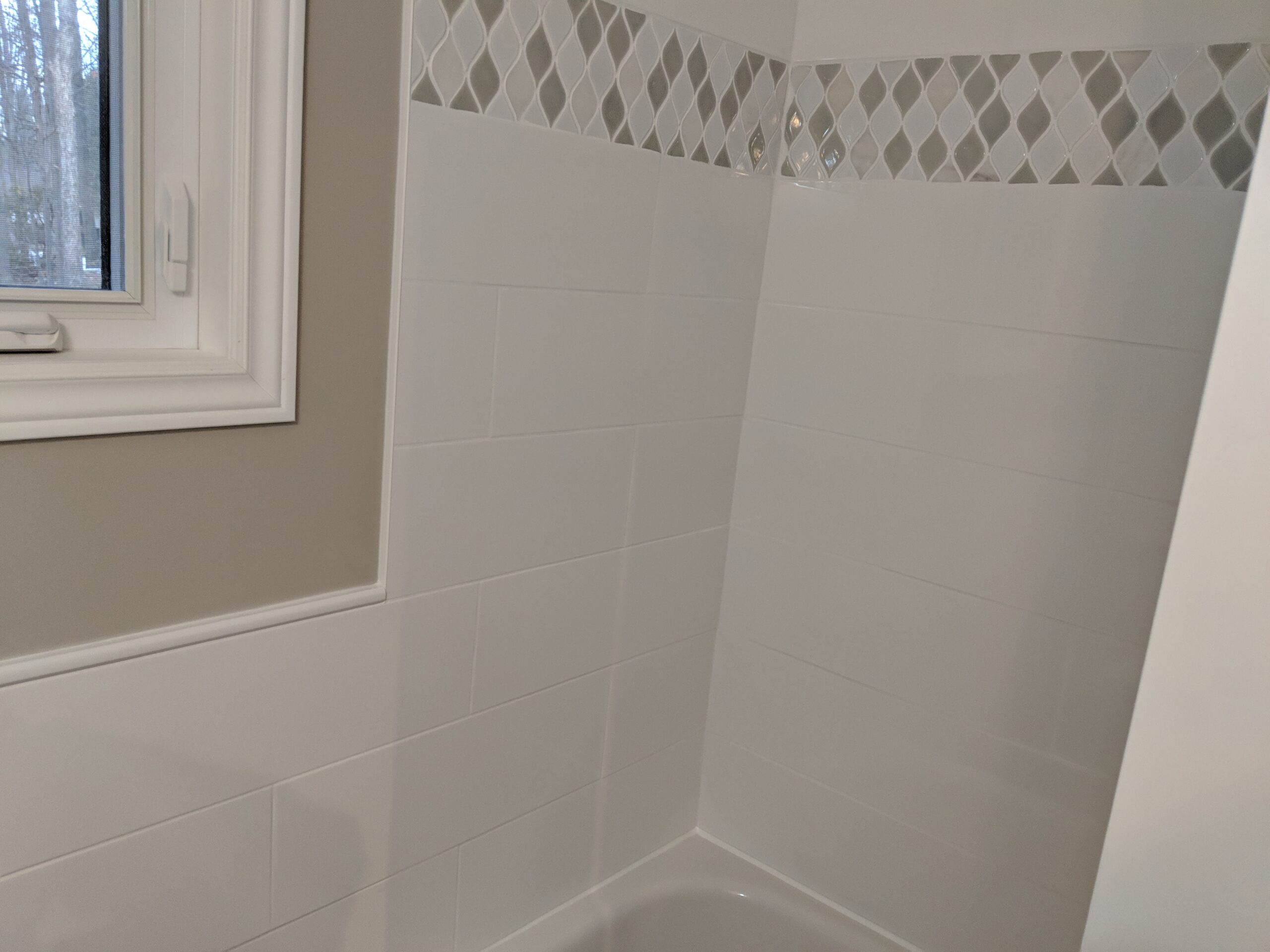 Custom bathroom renovation with new tile and paint in New Smyrna Beach Florida