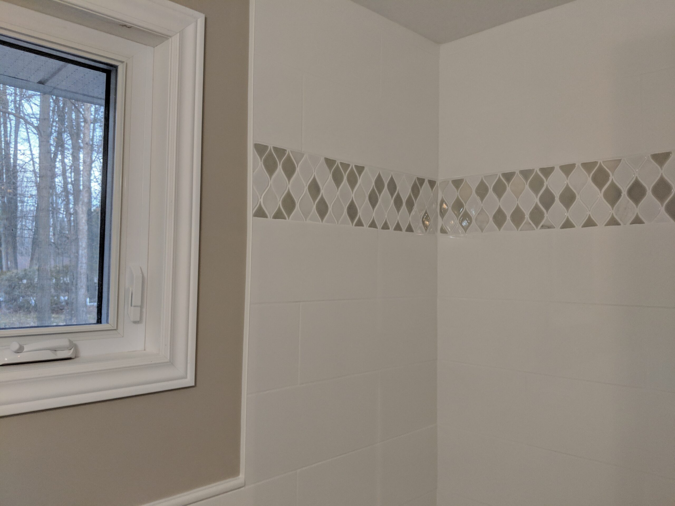Modern bathroom remodeling with new tile and paint in Daytona Beach Shores Florida