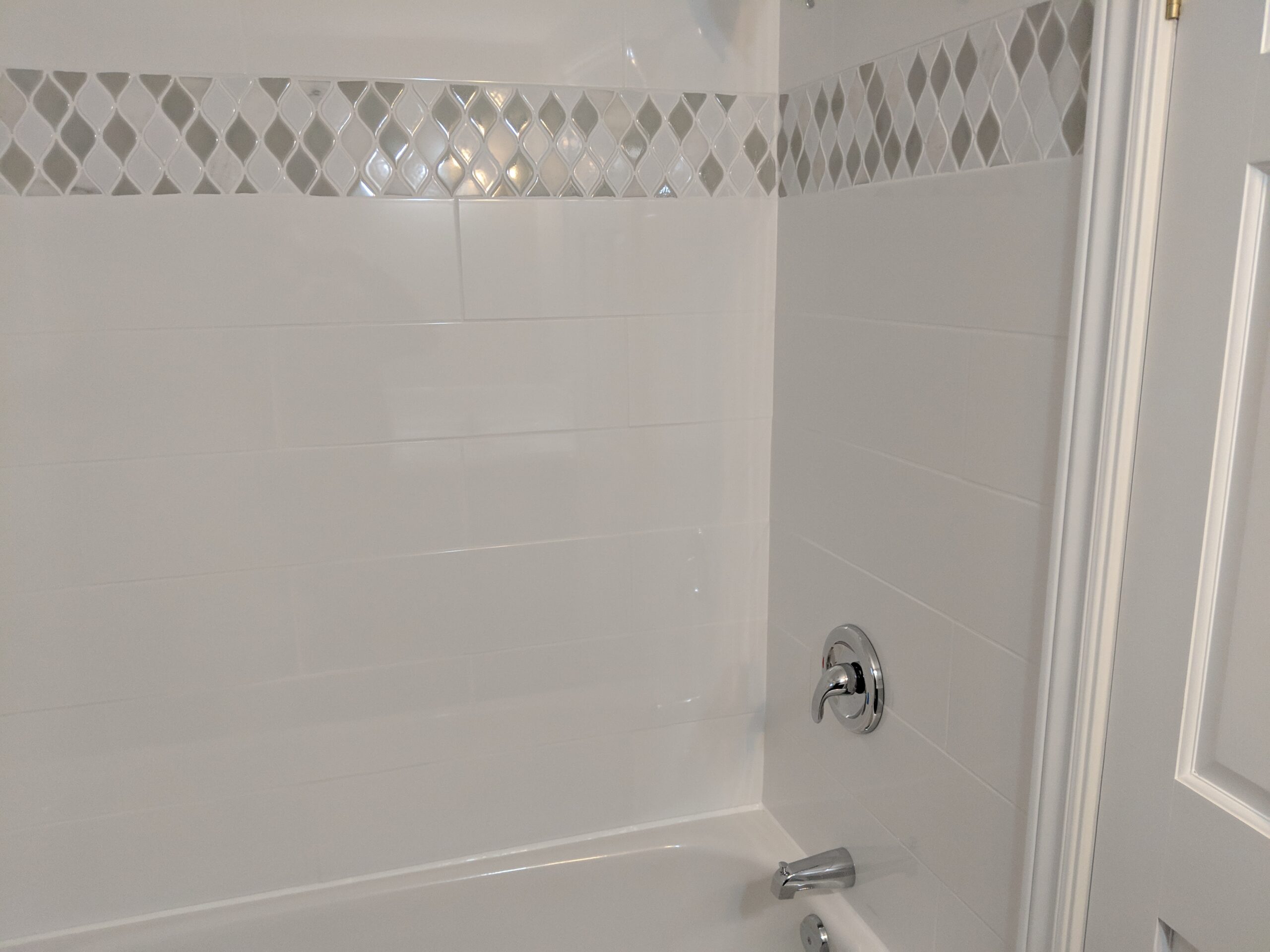 Custom bathroom renovation with new tile and paint in South Daytona Florida