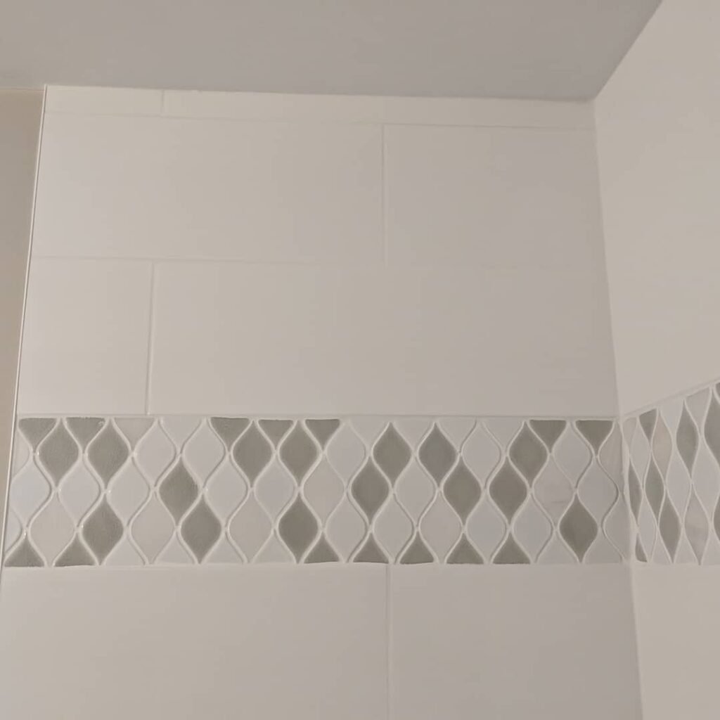 Modern bathroom remodeling with new tile and paint in Daytona Beach Shores Florida