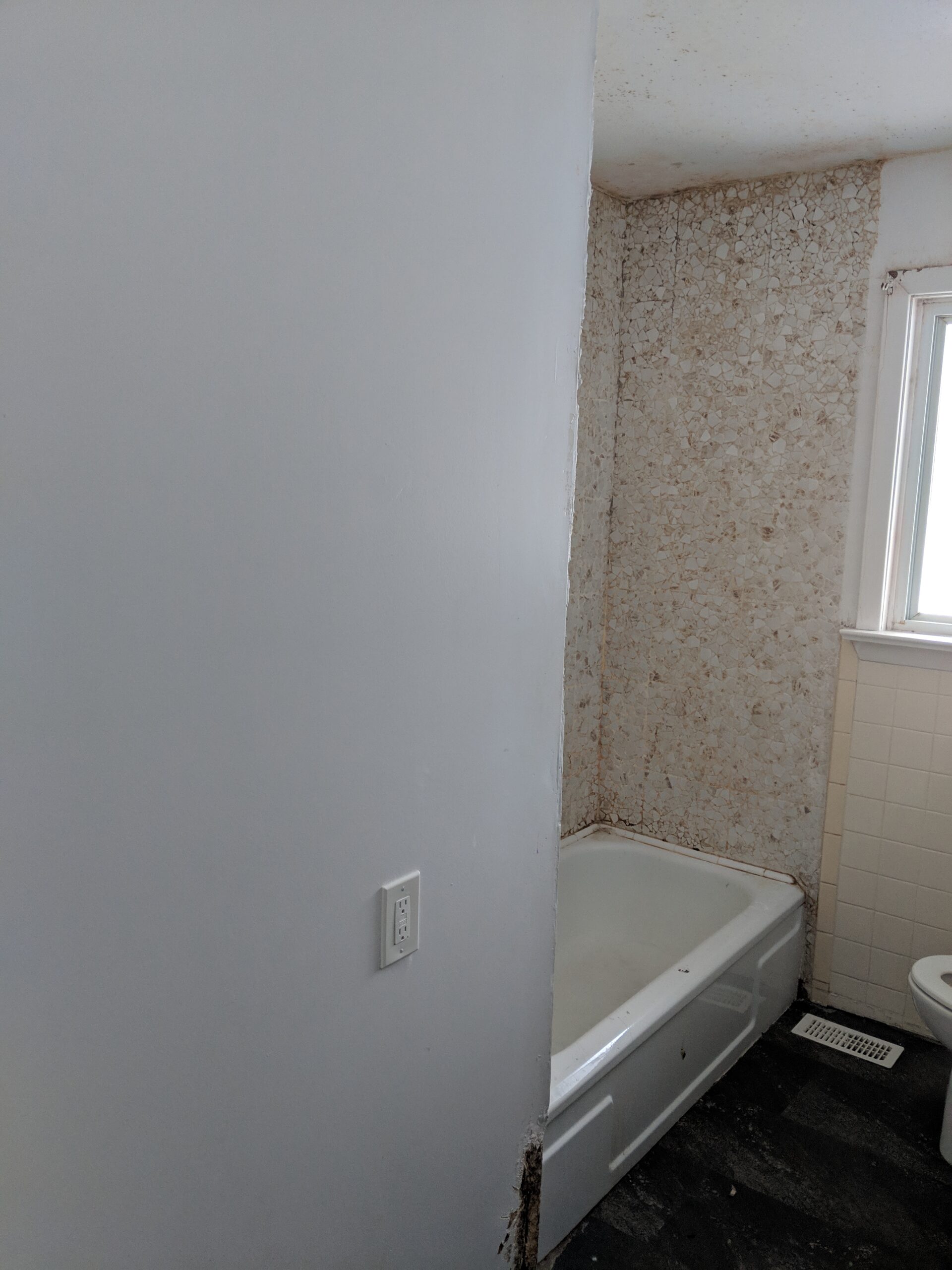 Modern bathroom remodeling with new tile and paint in Daytona Beach Shores Florida