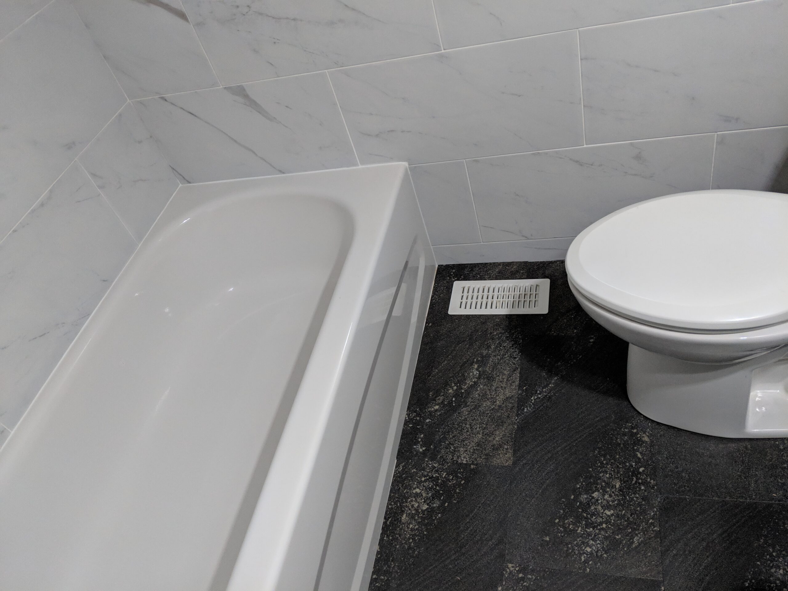 Custom bathroom renovation with new tile and paint in South Daytona Florida