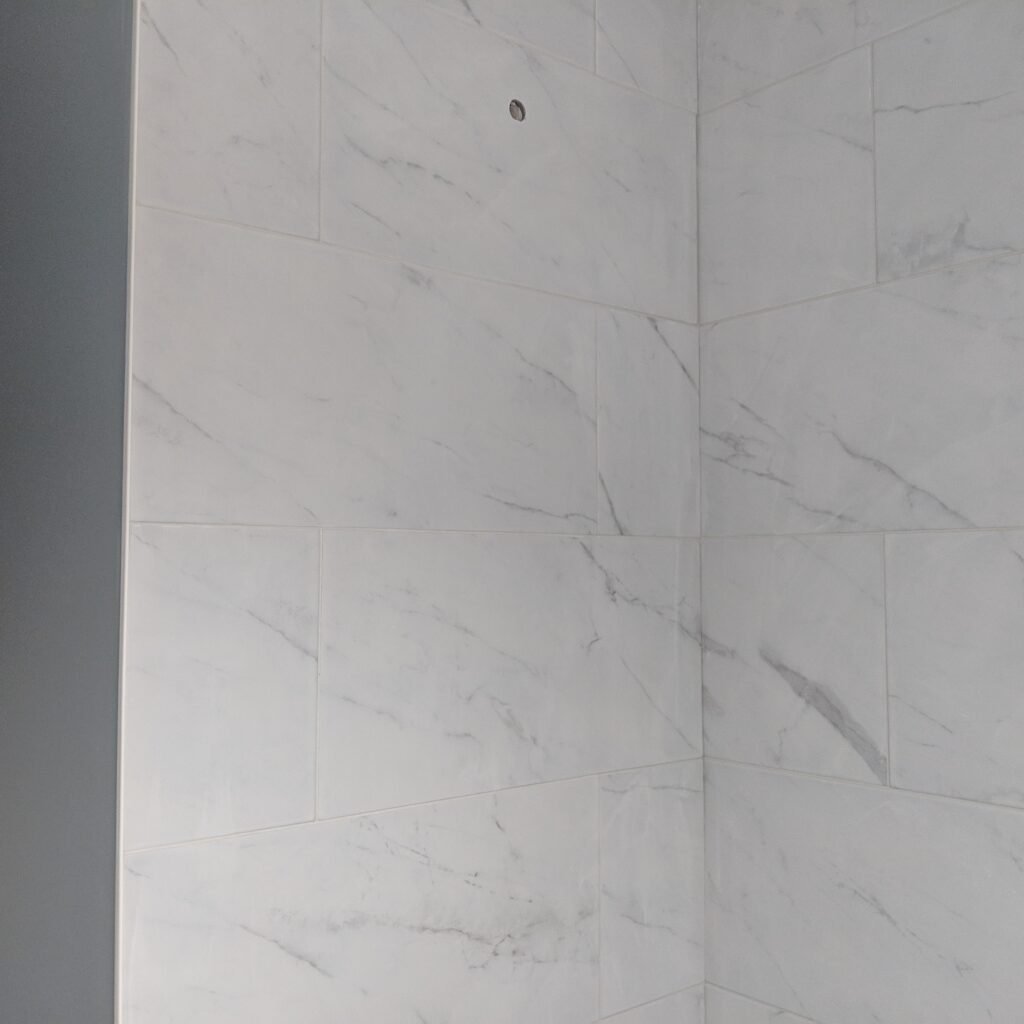 Custom bathroom renovation with new tile and paint in New Smyrna Beach Florida