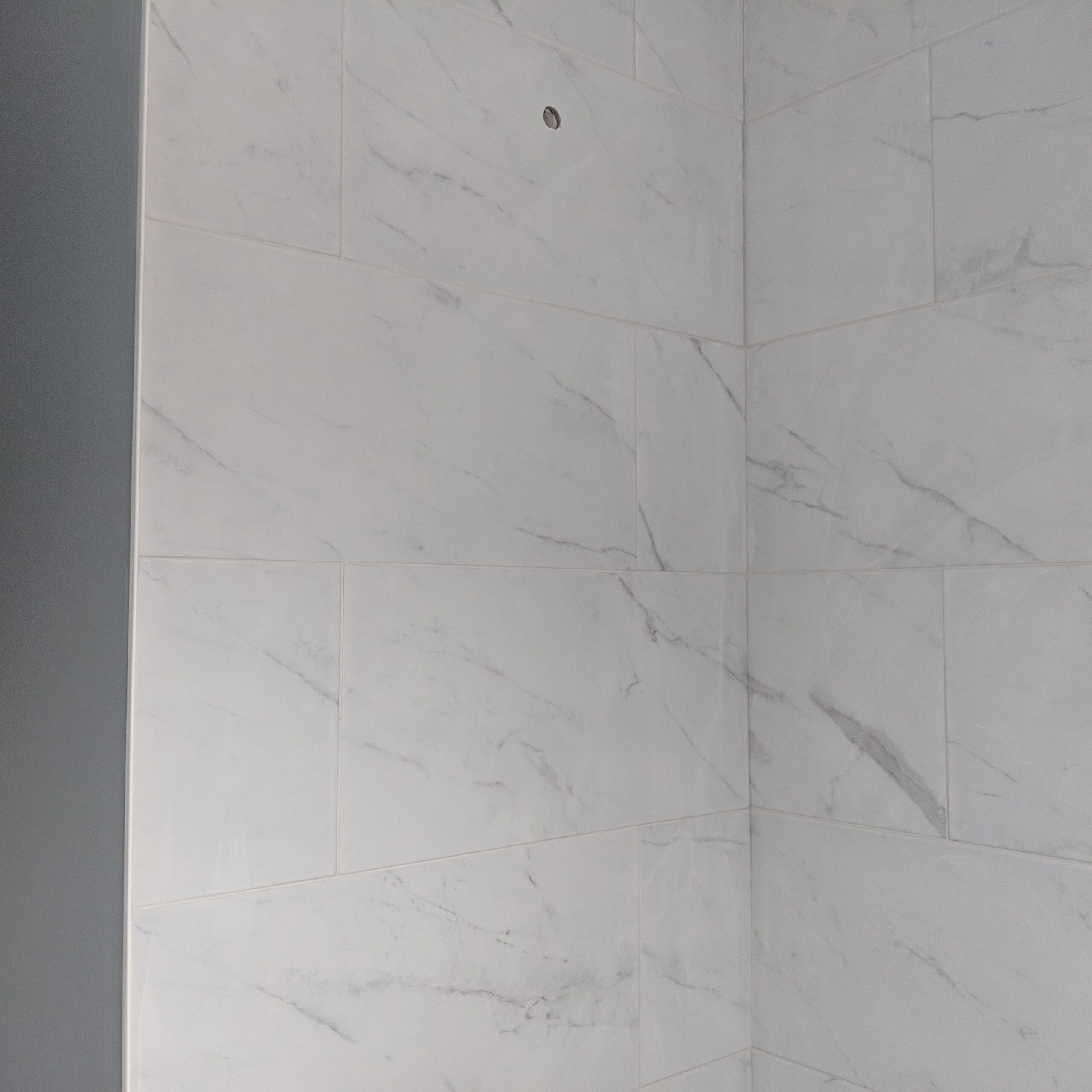 Custom bathroom renovation with new tile and paint in New Smyrna Beach Florida
