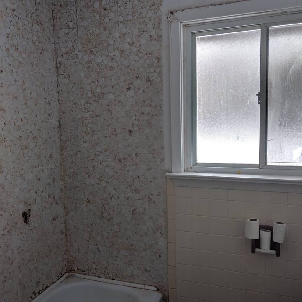 Modern bathroom remodeling with new tile and paint in Daytona Beach Shores Florida