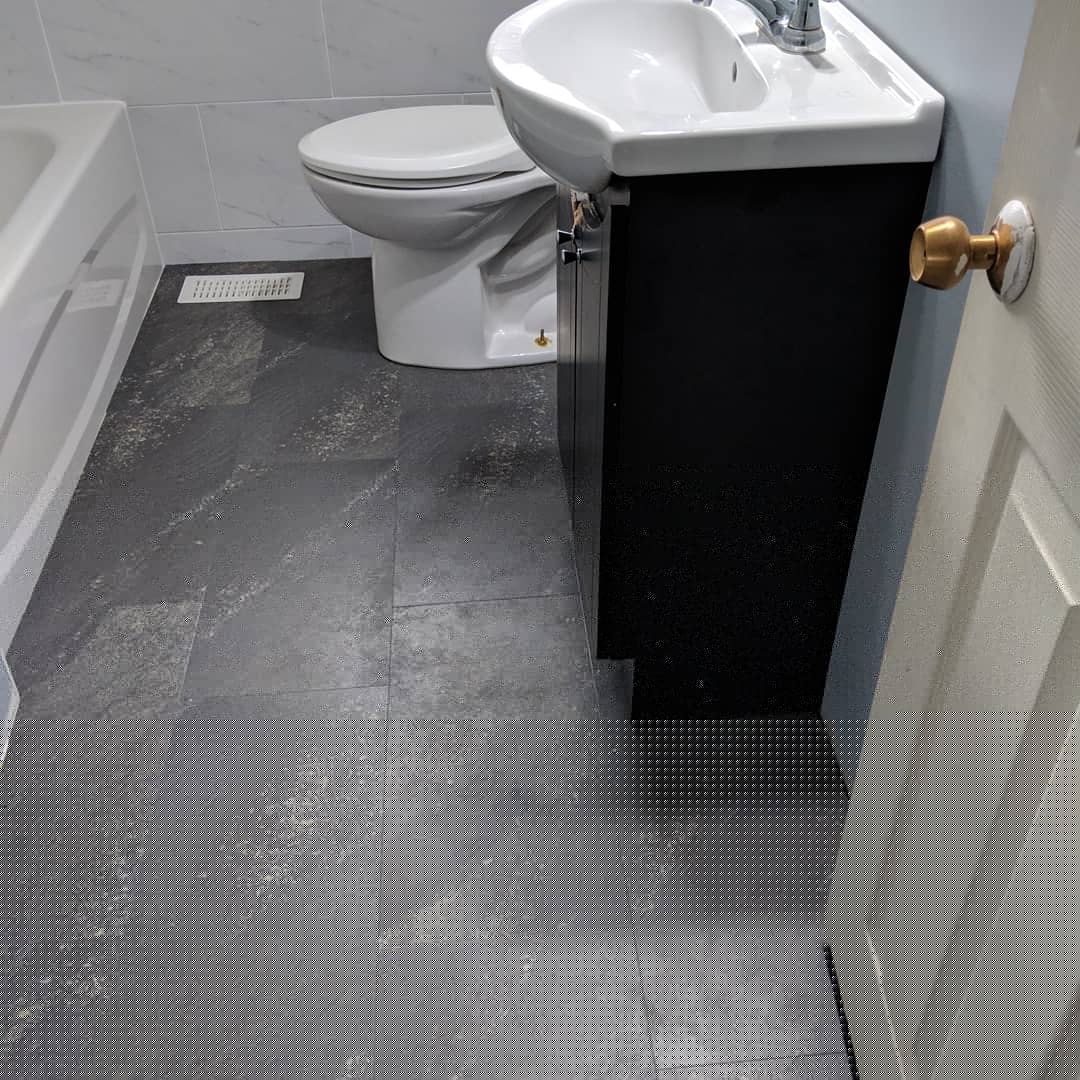 Modern bathroom remodeling with new tile and paint in Daytona Beach Shores Florida