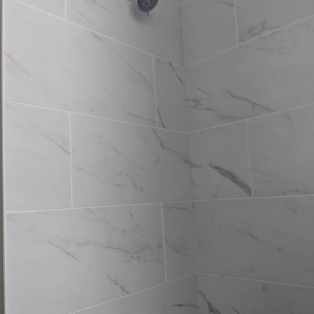 Custom bathroom renovation with new tile and paint in South Daytona Florida