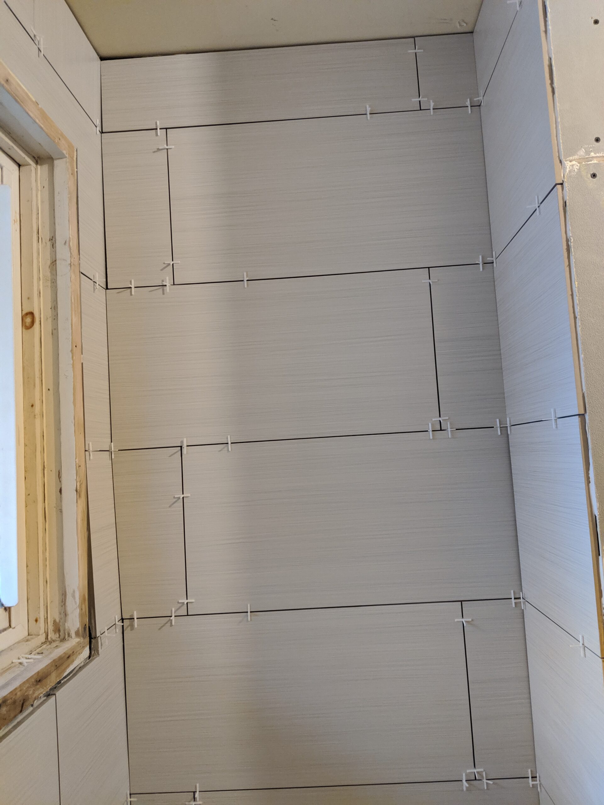 Modern bathroom remodeling with new tile and paint in Daytona Beach Shores Florida