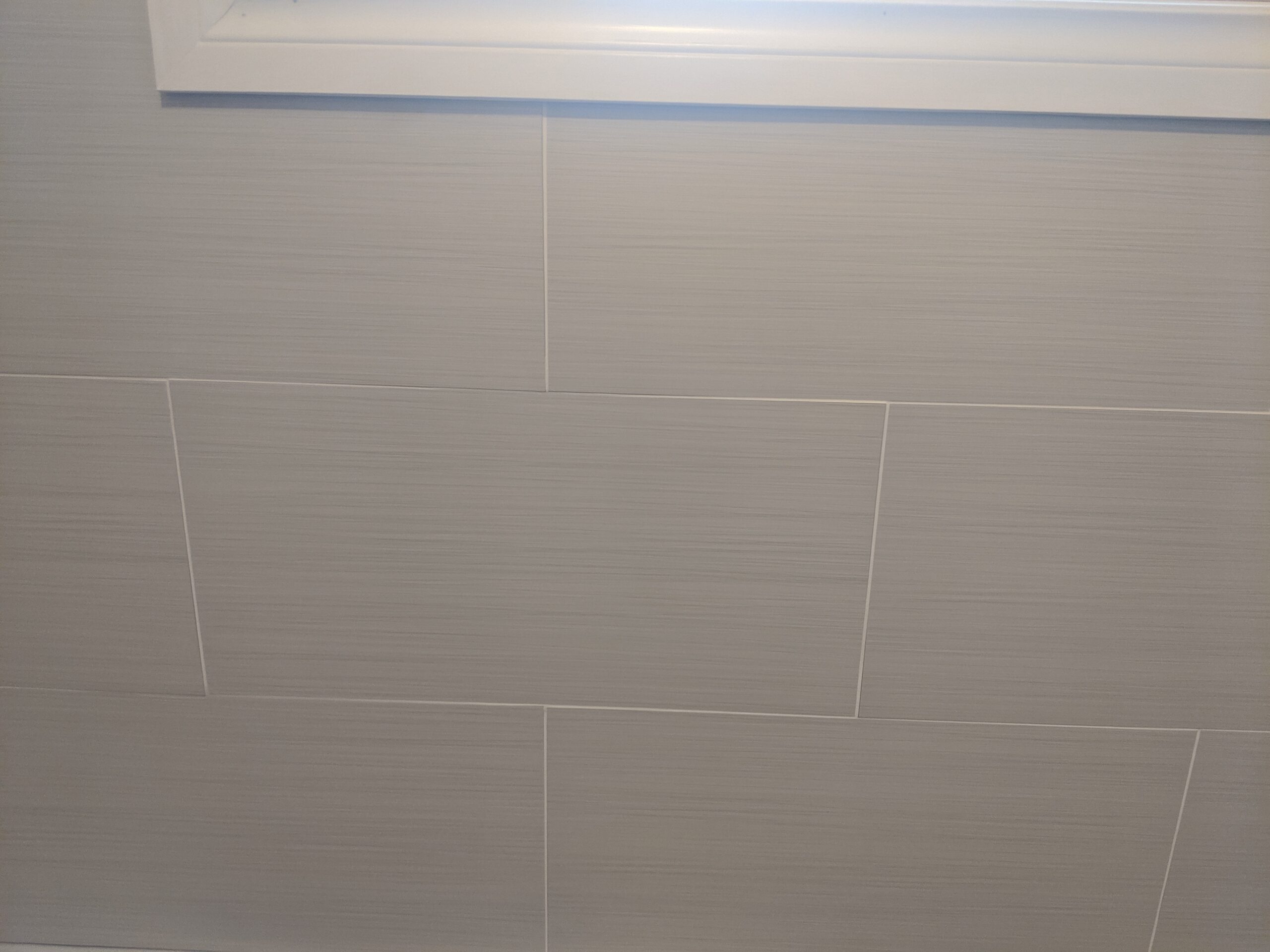 Modern bathroom remodeling with new tile and paint in Daytona Beach Florida