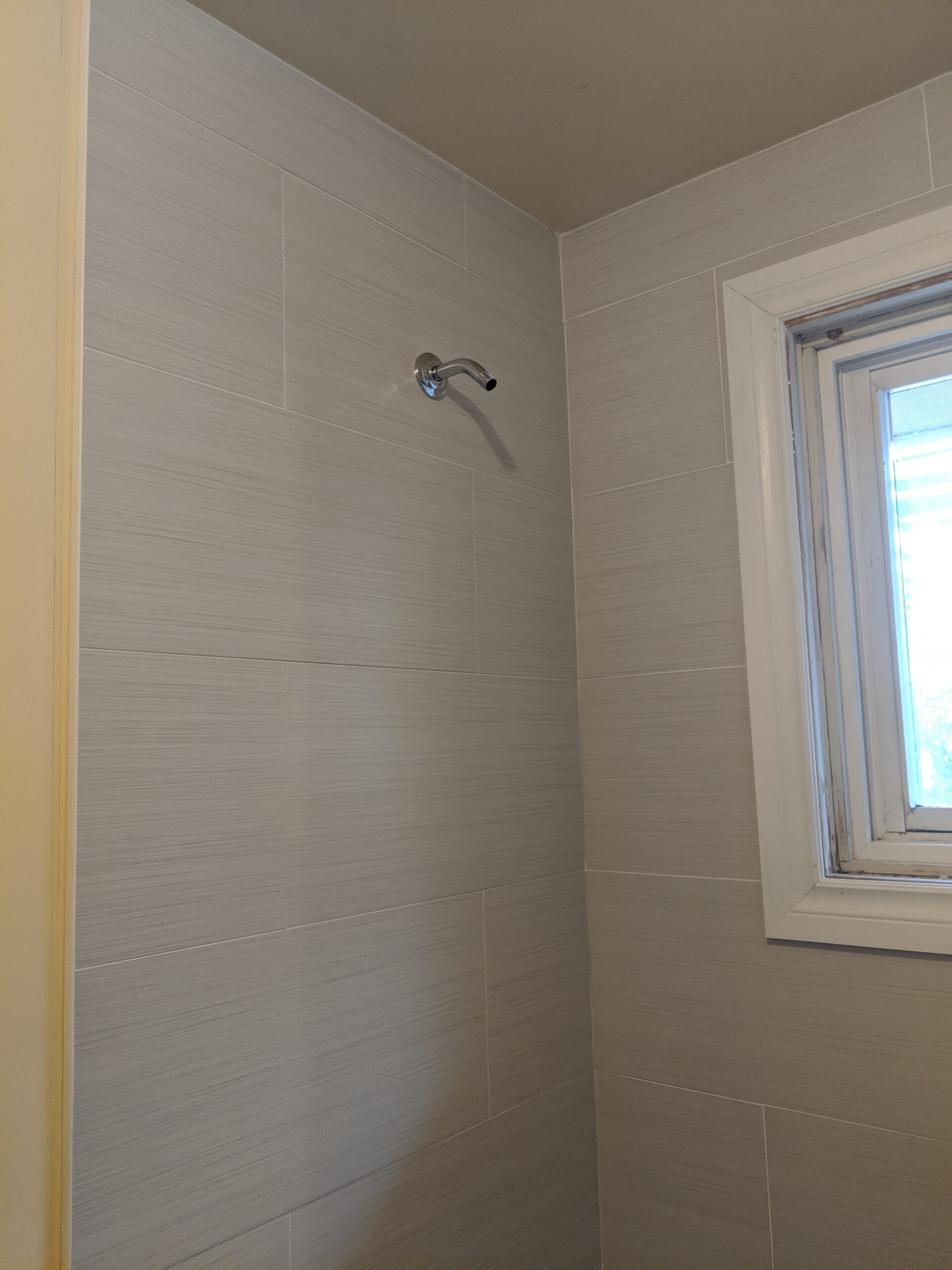 Custom bathroom renovation with new tile and paint in New Smyrna Beach Florida