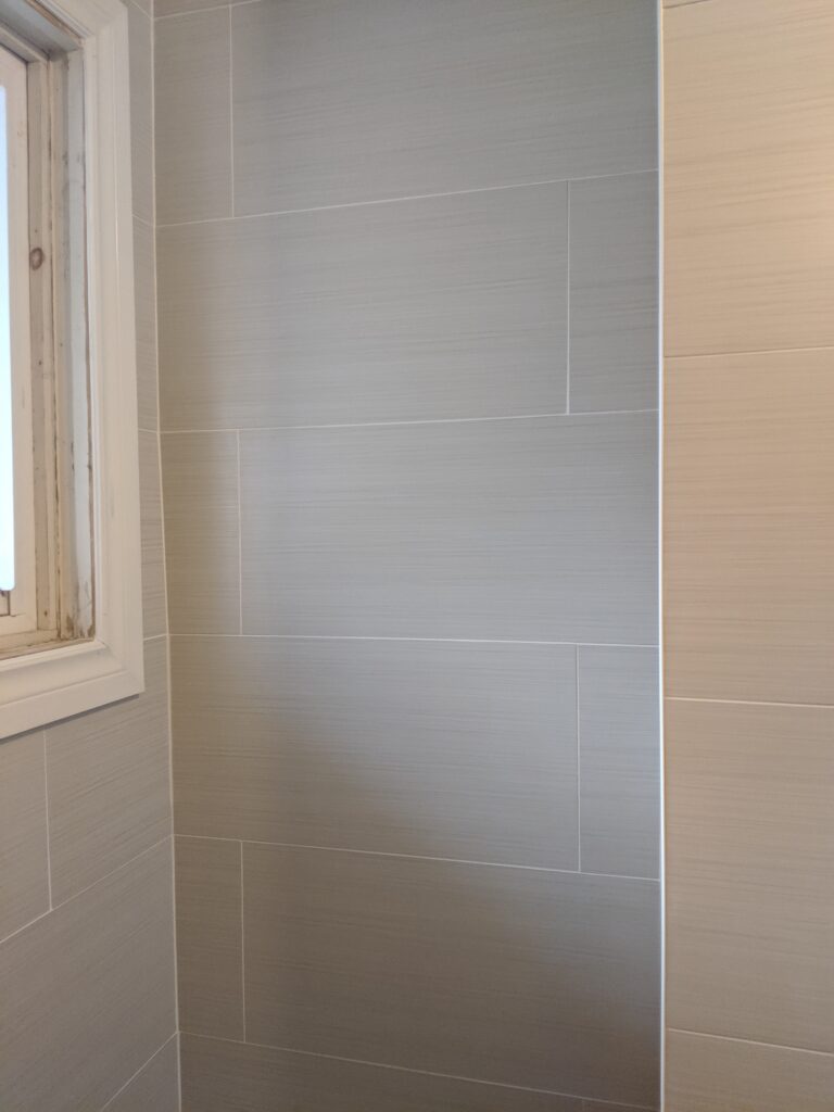 Modern bathroom remodeling with new tile and paint in Daytona Beach Florida