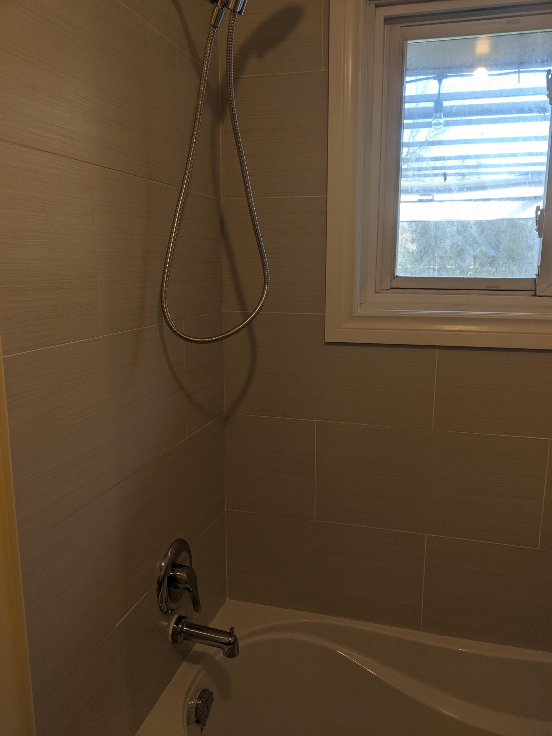 Custom bathroom renovation with new tile and paint in New Smyrna Beach Florida