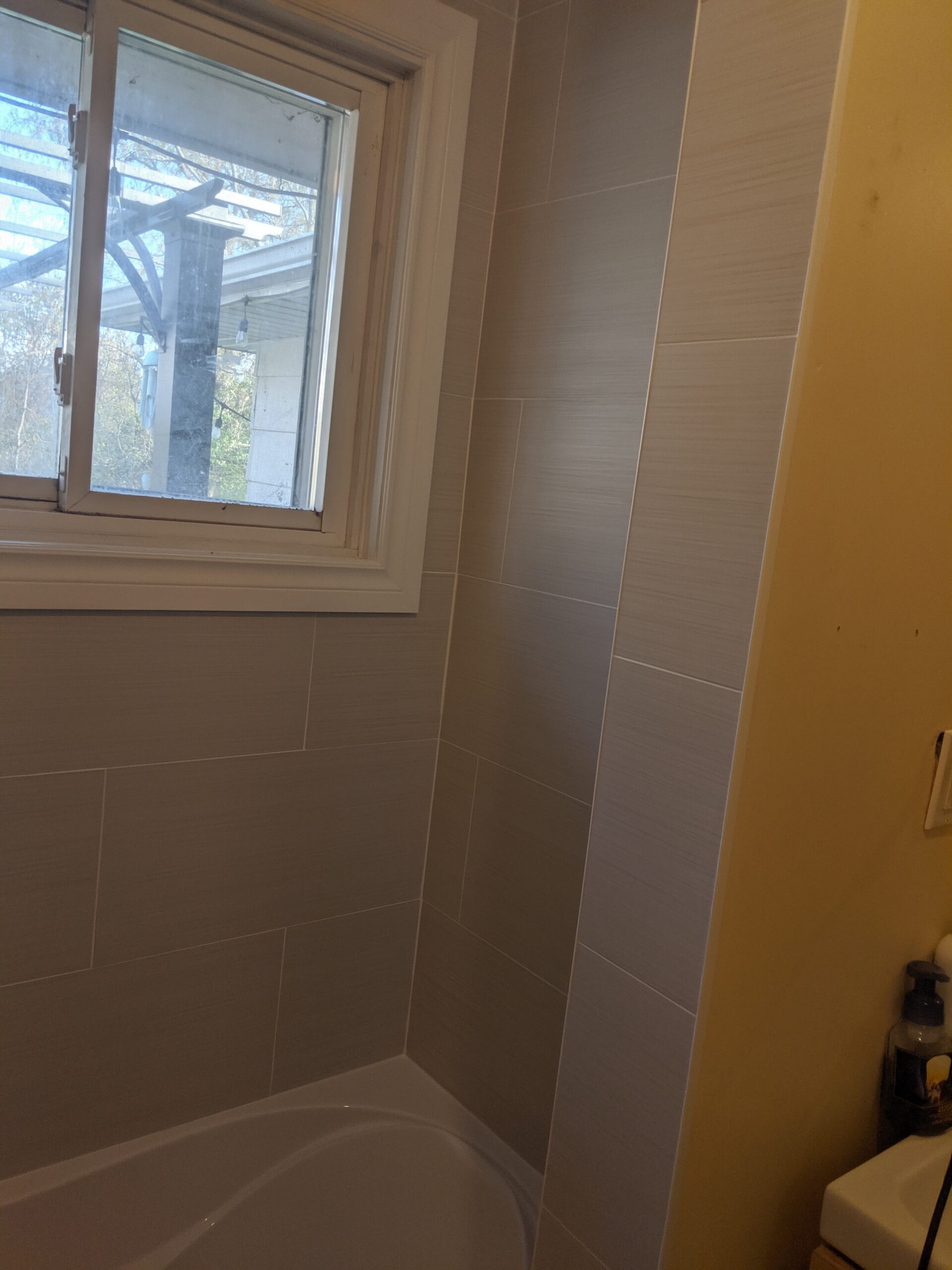 Custom bathroom renovation with new tile and paint in South Daytona Florida