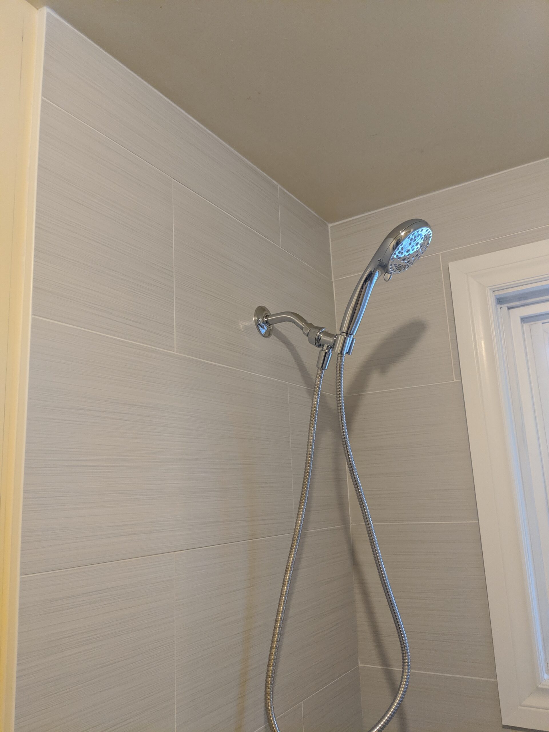 Modern bathroom remodeling with new tile and paint in Daytona Beach Shores Florida