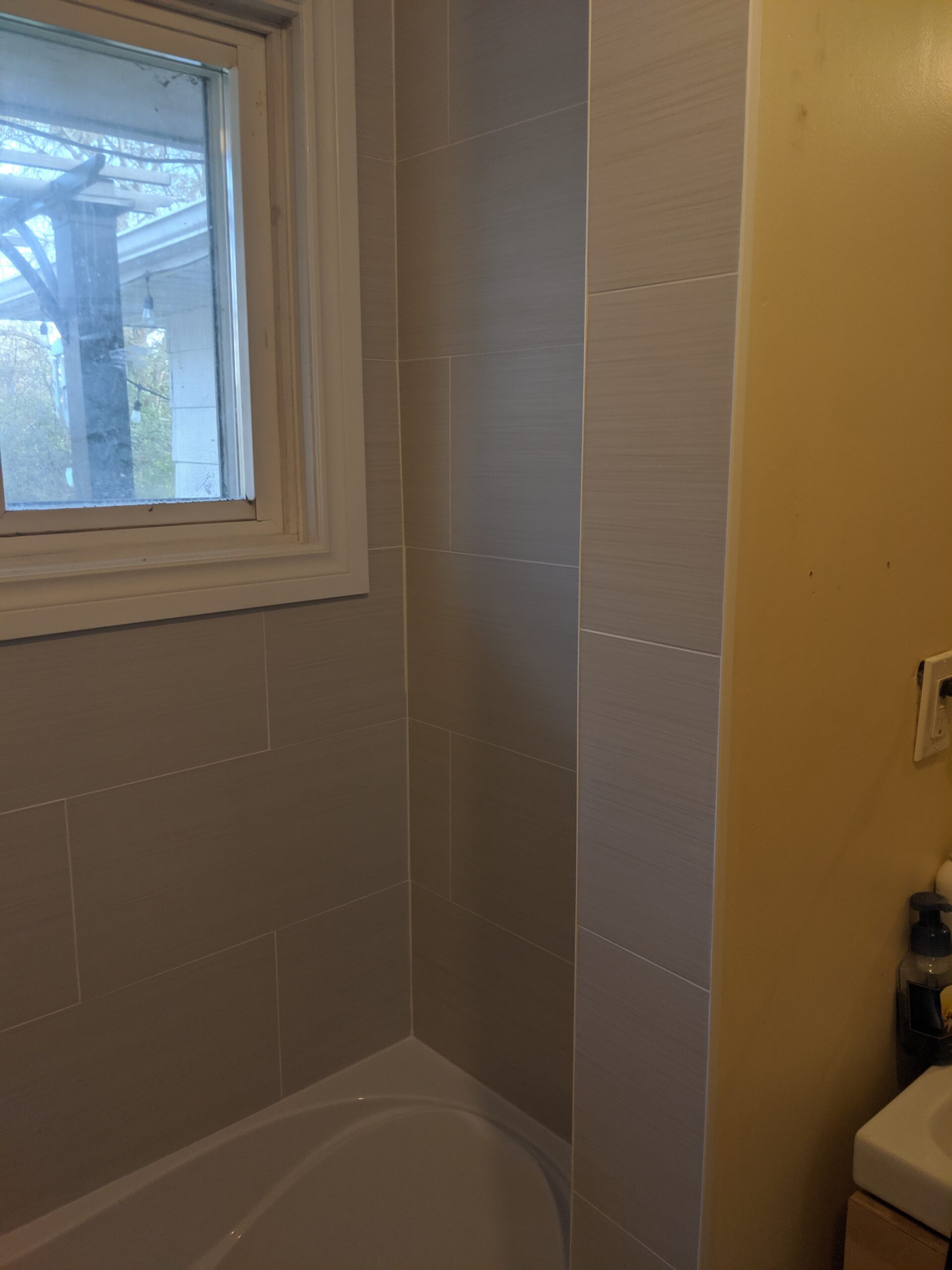 Custom bathroom renovation with new tile and paint in New Smyrna Beach Florida