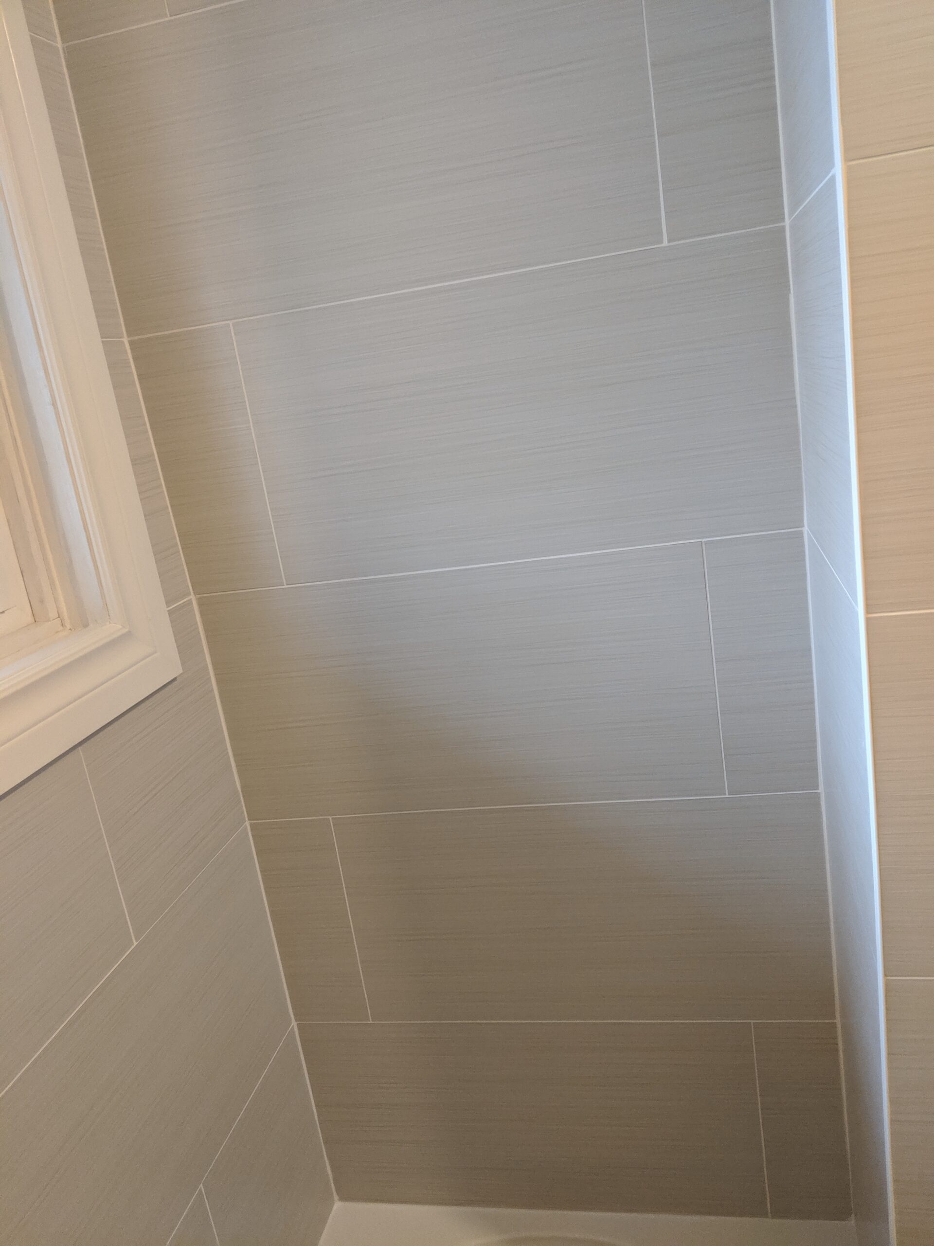 Modern bathroom remodeling with new tile and paint in Daytona Beach Shores Florida