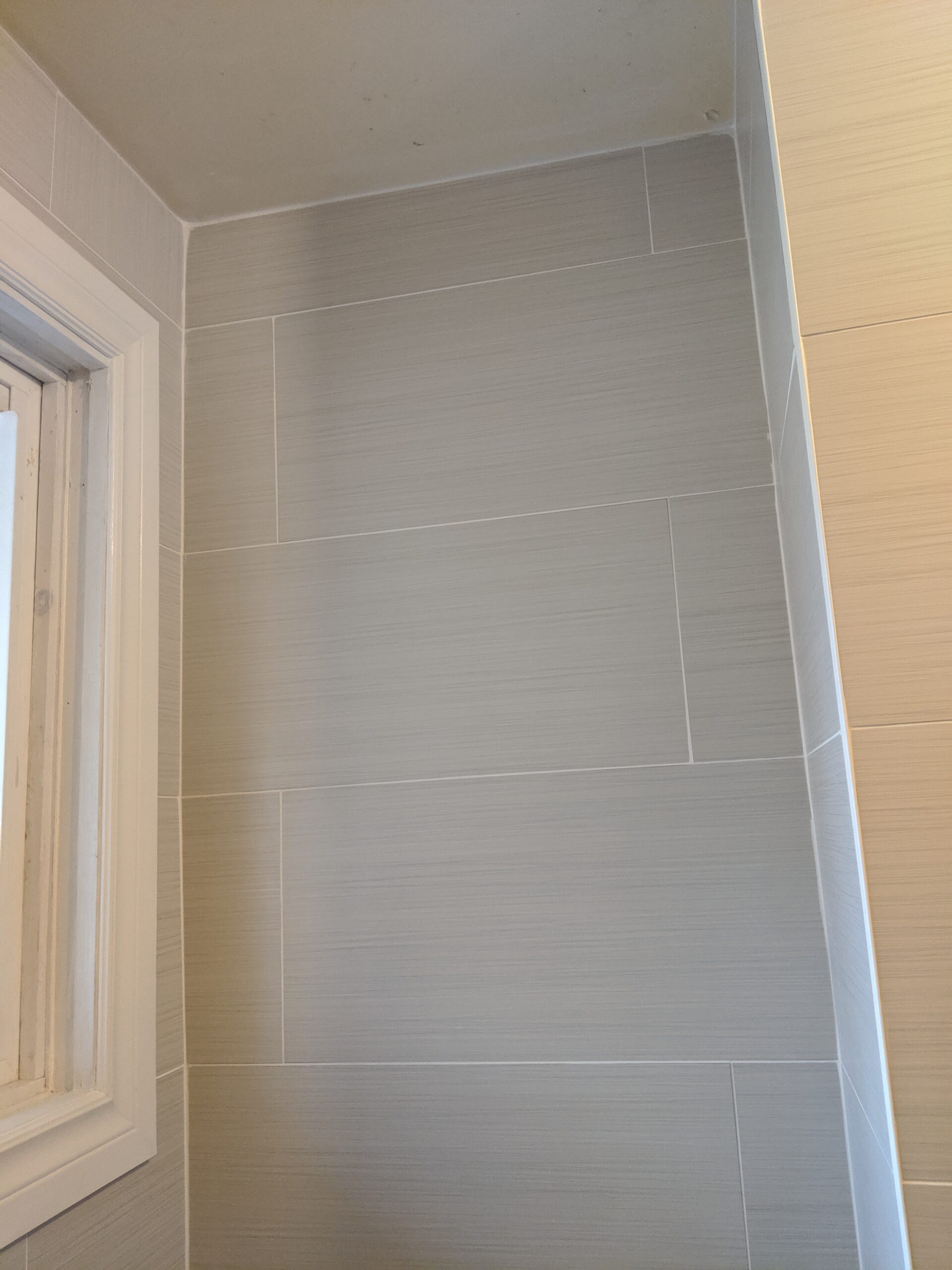 Custom bathroom renovation with new tile and paint in South Daytona Florida